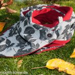 Knopfschall mit Etikett: Einmalig